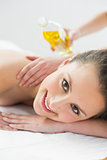 Portrait of beautiful woman enjoying oil massage