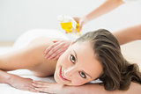 Portrait of beautiful woman enjoying oil massage