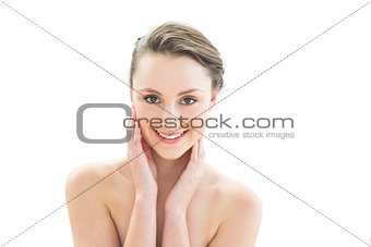 Close up of a beautiful woman touching her face