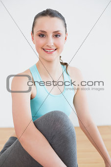 Portrait of a fit woman in fitness studio