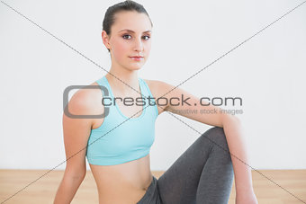 Portrait of a fit woman in fitness studio