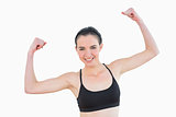 Portrait of sporty fit young woman clenching fists