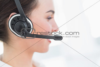 Close up side view of businesswoman wearing headset