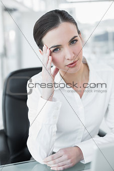 Worried businesswoman with laptop at office