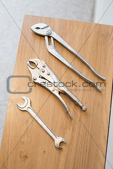 Work tools on wooden surface