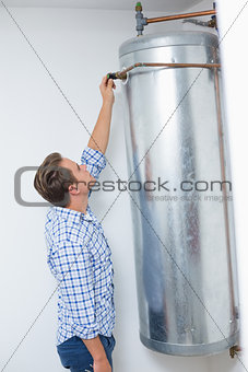 Technician servicing an hot water heater