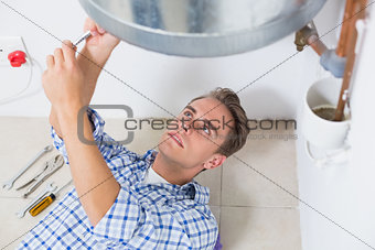 Technician servicing an hot water heater