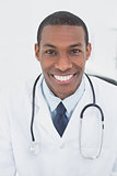 Close up portrait of a smiling male doctor