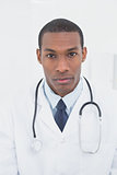 Close up portrait of a serious male doctor