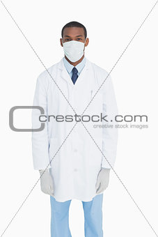 Portrait of male doctor wearing mask and gloves