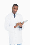Portrait of a serious male doctor with clipboard