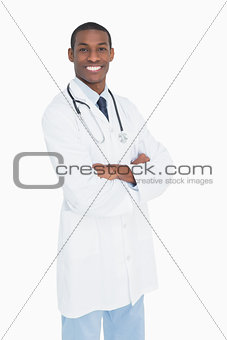 Portrait of a smiling male doctor with arms crossed