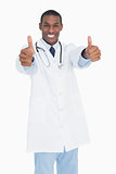 Portrait of a happy male doctor thumbs up