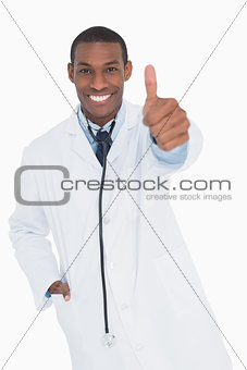 Portrait of a happy male doctor gesturing thumbs up
