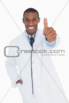 Portrait of a happy male doctor gesturing thumbs up