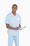 Portrait of a smiling male surgeon with clipboard