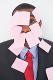 Close up portrait of Afro businessman covered in blank notes