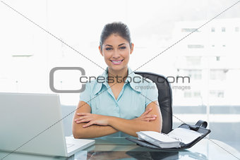 Elegant businesswoman with laptop in office