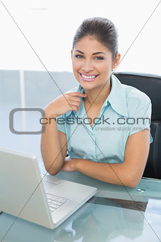 Portrait of businesswoman with laptop office