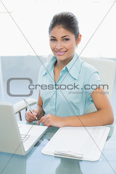 Portrait of an businesswoman with laptop at office