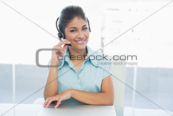 Confident businesswoman wearing headset