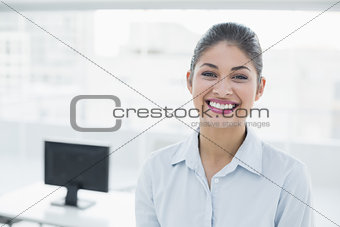 Confident businesswoman  smiling at office