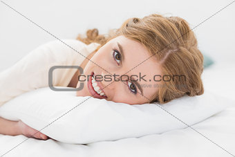 Close up of pretty woman resting in bed