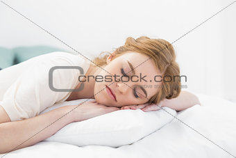 Close up of pretty young woman sleeping in bed