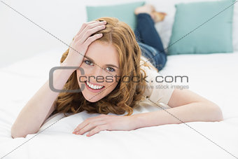 Portrait of a smiling pretty woman in bed