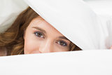 Close up portrait of a pretty woman in bed