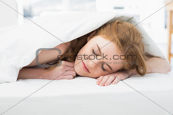 Close up of a pretty woman sleeping in bed
