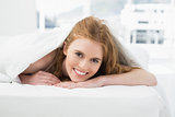 Close up portrait of pretty woman in bed