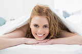 Close up portrait of a pretty woman in bed