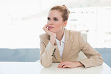 Thoughtful businesswoman sitting in office