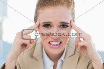 Close up of businesswoman suffering from headache
