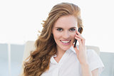 Portrait of businesswoman using cellphone in office