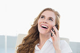 Close up of cheerful businesswoman using cellphone