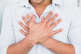 Mid section of man with chest pain