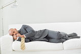 Elegant businessman sleeping on sofa