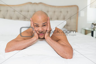 Close up of a young man resting in bed