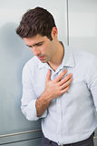 Casual young man with chest pain