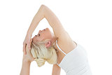 Toned young woman doing the pigeon pose