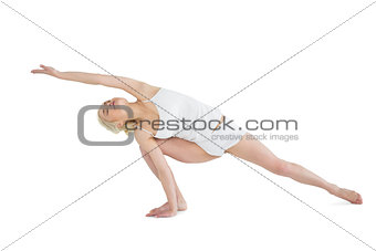 Full length of a sporty young woman practicing yoga