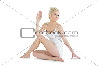 Toned woman in the Ardha Matsyendrasana position