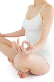Toned young woman sitting in lotus position