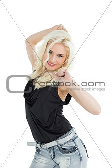 Portrait of happy young casual woman dancing