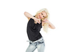 Portrait of happy young casual woman dancing
