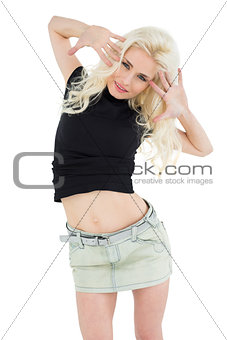 Portrait of a smiling beautiful casual blond posing