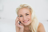 Close up of relaxed woman using mobile phone