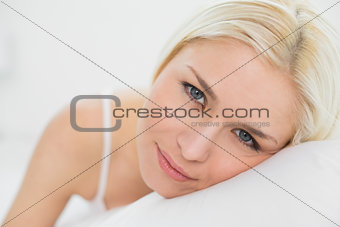 Close up portrait of a beautiful blond in bed